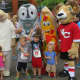 Mascots stand with children at the All Out For Autism 5k in New Canaan.
