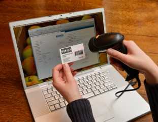 Dana Robertson, of Larchmont, has developed a state-of-the-art barcode system that registers and catalogues the 380 families from Larchmont and Mamaroneck who visit the Food Pantry. 