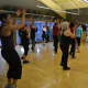 Patrons dance and have fun in fitness classes offered during open house. 