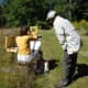 Painter Dmitri Wright works with a student painting en plein air at Weir Farm National Historic Site.