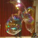 Johnson creates large bubbles using a hula hoop at the New Canaan Library.