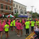 Runners mingle near the starting line prior to Friday's All Out For Autism 5k race in New Canaan.