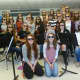 Orchestra students pose in their sunglasses in honor of World Vision Day. 