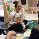 Children listen at the recent Family Literacy Night at the Lathon Wider Community Center in Stamford.