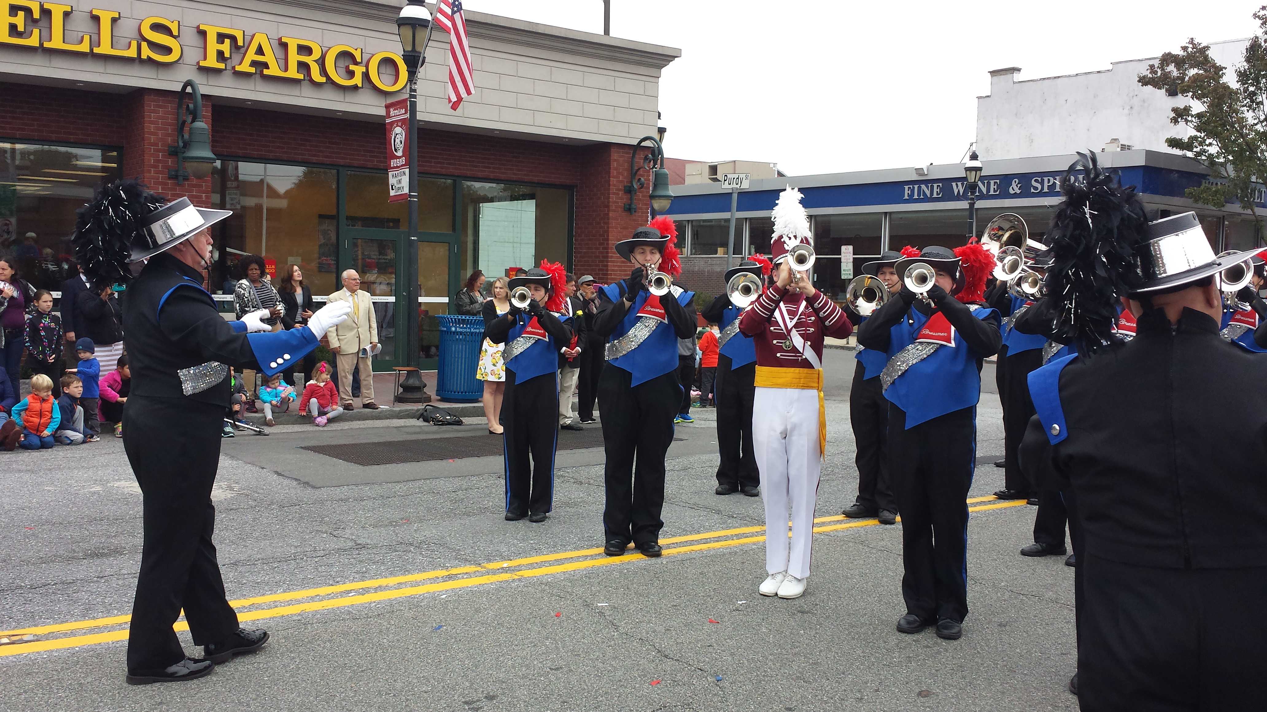 Joe Mazzullo, left, led the Westchester Brassmen Drum & Bugle Corps during a previous Columbus Day Parade in Harrison. The annual downtown parade coincides with "It's Great to Live in Harrison Day."