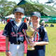 Weston resident, Sam Hensinger, 10, and Wilton resident, Chris Jones, 11. first met on a baseball field in Hong Kong. Here they are pictured in the Philippines for a baseball tournament.

