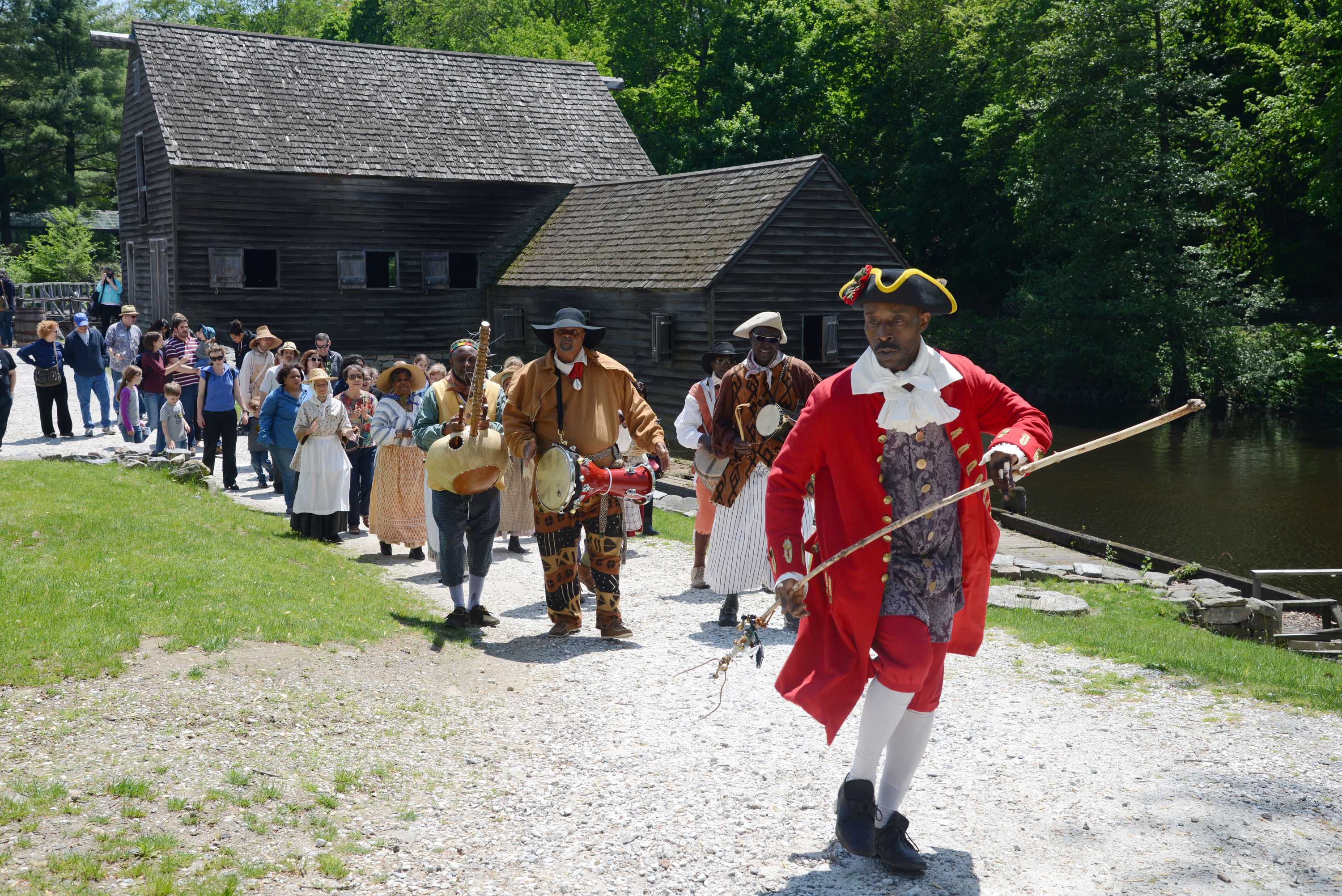 The Pinkster King leads a musical parade.
