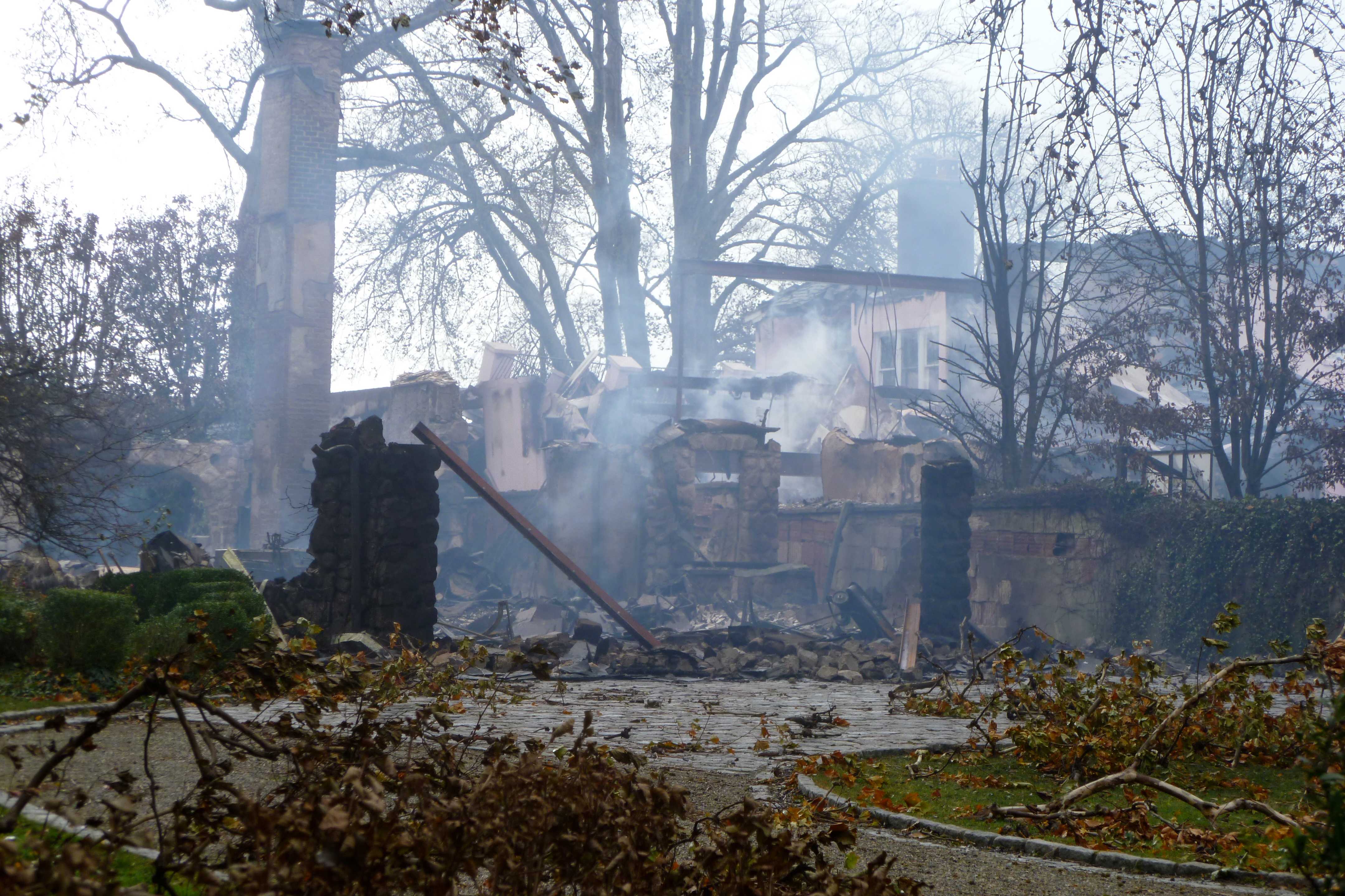 This house in Greenwich smolders after burning to the ground during the height of Hurricane Sandy.