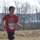 Christopher Carratu of the New Canaan Running Club competes in Sunday's race.