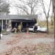 A fire damaged a garage after a car collided with a home on White Birch Road in New Canaan Thursday afternoon. 