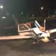 A small plane that crash-landed early Saturday sits in a parking lot off King Street near Westchester County Airport.