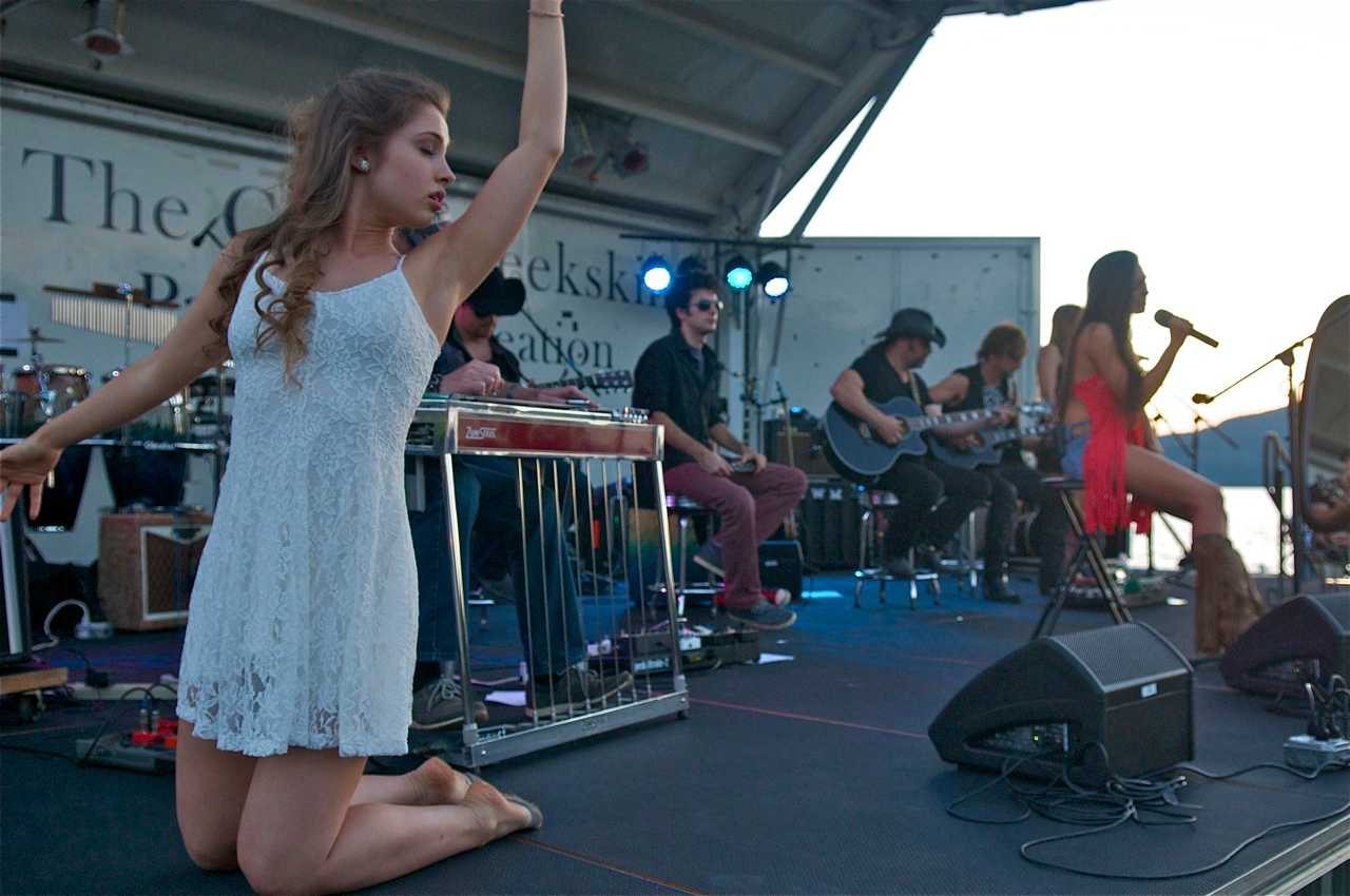 A dancer performs on stage with Jessica Lynn's song "Pretty."