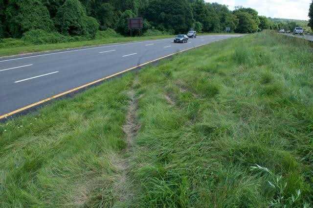 A look at the  tire marks and tracks in the northbound lane where the BMW SUV exited  into the center median, struck an earth embankment, and became airborne into the southbound lanes.