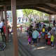 Families and friends gather for a BBQ and fun at Washington Village. 