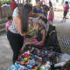 A girl gets her face painted at Family Day.