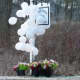 Balloons and flowers surrounded the Sandy Hook School sign in Newtown back in December 2012.
