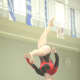 Caroline Fitzpatrick of New Canaan competes on the balance beam.