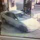 Surveillance footage of the suspect car in an armed robbery at a Norwalk gas station on Friday