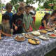 Kids line up to taste pies at Saturdays Second Annual Rock 'N Roots Revival Music Festival at Lonetown Farm in Redding.
