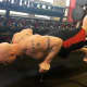 Phil Ross performs Nuero Grip pushups inside his American Eagle MMA studio.