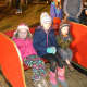 Kids of all ages enjoy the tree lighting at the Ram Pasture in Newtown.