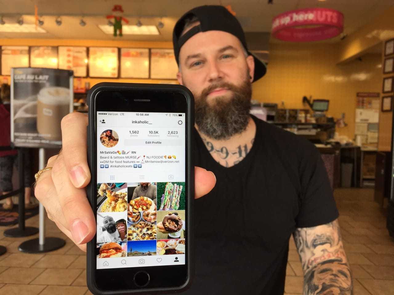 Matt Savage of Garfield displays his Instagram in a Lodi Dunkin Donuts.