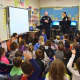 Sgt. William Carroll and police officer Cheryl Jarosz from the Bronxville Police Department provided Bronxville Elementary School first-graders with safety tips and advice about strangers.