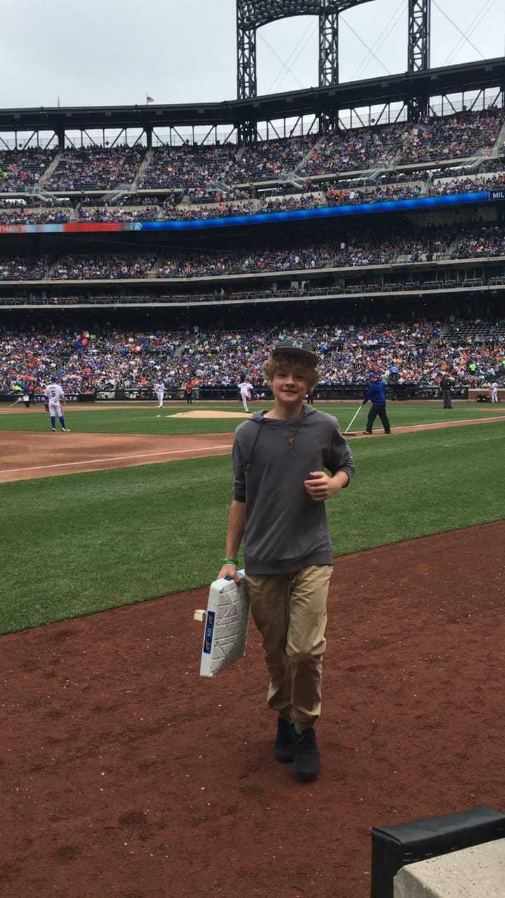 Jakub Kosinski was invited onto the field to change bases in between innings during Sunday's Mets game.