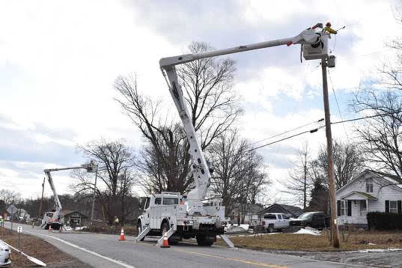 Repairs crews restore electric service in Dutchess County on Monday.