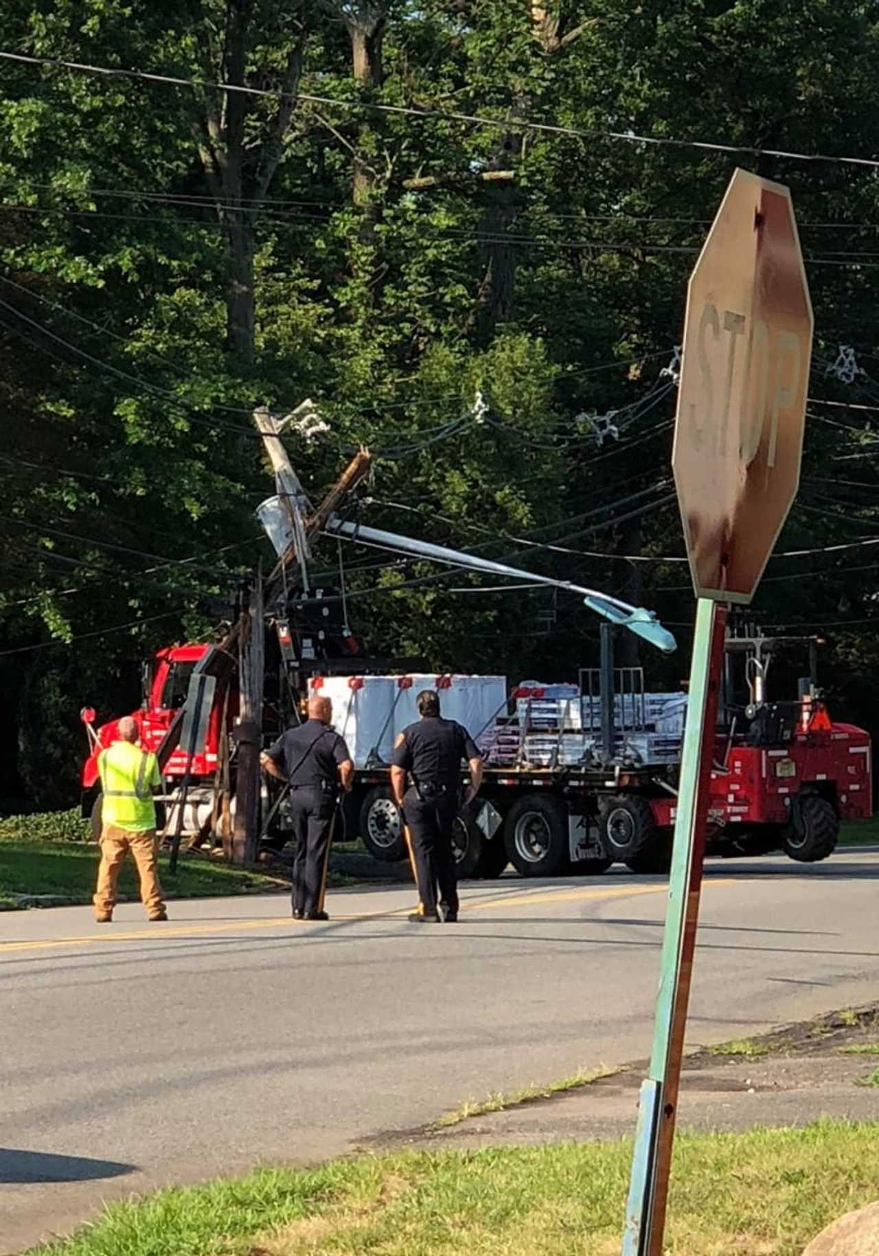 Truck Snaps Utility Pole After Snagging Power Lines In Hackensack