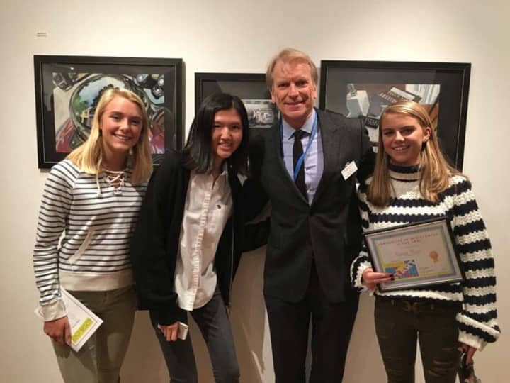 Bronxville High School students Vance Wood, Lauren Lee and Maggie Miller pictured with Concordia College Chief Marketing Officer Jim Bunn.