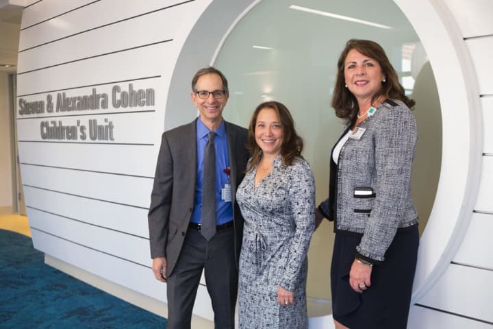 Steven and Alexandra Cohen join Kathleen Silard, executive vice president of Stamford Hospital, to officially open the new Stamford Health Cohen Children’s Unit.