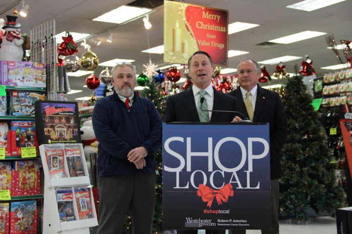 County Executive Rob Astorino makes a push for shopping locally during his appearance Wednesday, Nov. 25, in Eastchester. He is flanked by Will Humphries, of Eastchester&#x27;s Value Drugs, and Eastchester Supervisor Anthony Colavita.