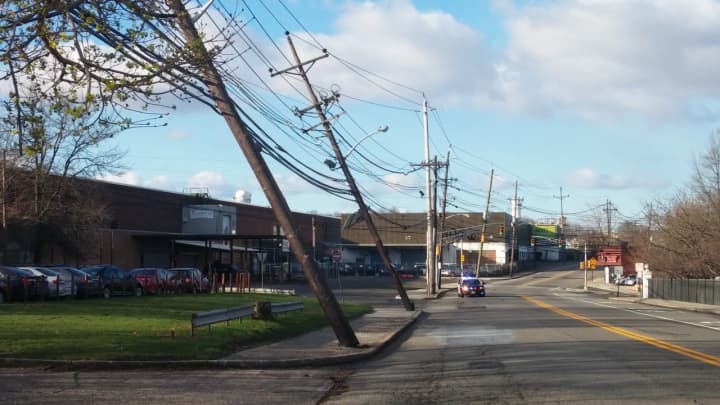 Utility poles tipped by the winds.