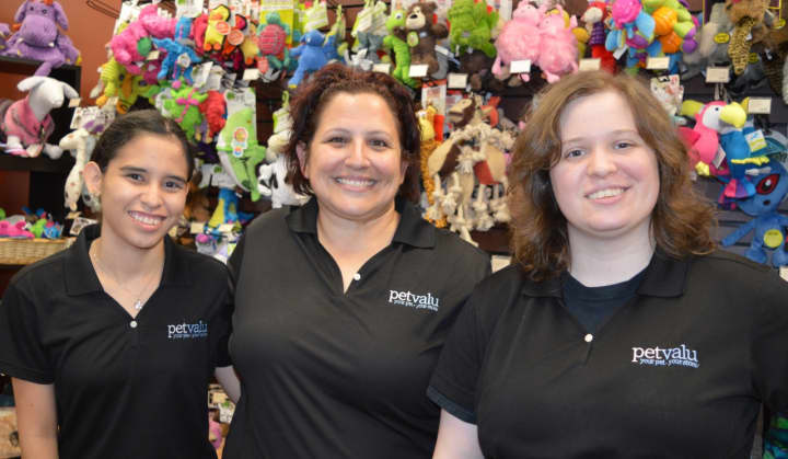 Christine Peterson, center, assistant manager of Pet Valu in Dumont, with some of her staffers.