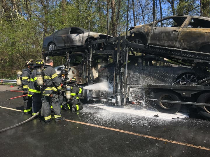Fire crews respond to a tractor-trailer car carrier fire on Interstate 95.