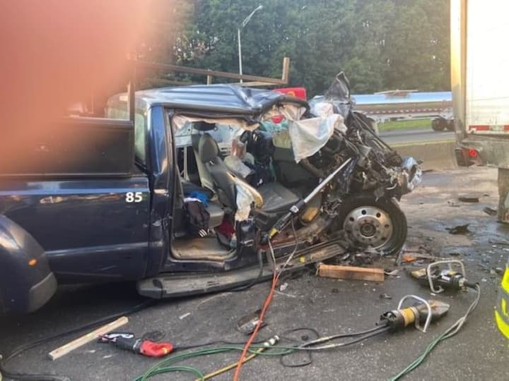 A pickup truck driver had to be extricated from his vehicle after driving into the back of a tractor-trailer on I-95 in Norwalk.