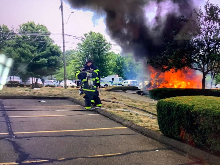 A fiery four-car crash took out three utility poles in Norwalk.
