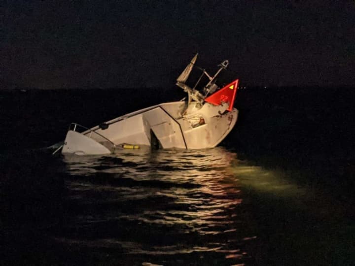 Six boaters were rescued overnight when their 30-foot white pleasure craft struck a fixed aid to navigation off Beach Haven, the US Coast Guard said.