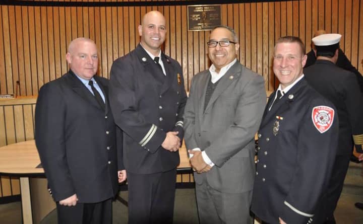 Christopher Di Bella, John Hayowyk, and John J. Tuohy of the Passaic Fire Department with Mayor Alex D. Blanco.