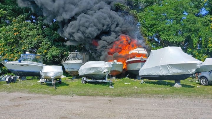 Firefighters were able to contain a fire involving two boats at an area marina.