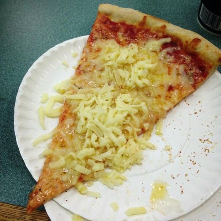 A famous &quot;cold cheese slice&quot; from Huntington pizza staple Little Vincent&#x27;s, located at 329 New York Avenue.