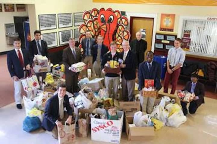 Students and staff members at Iona Preparatory, an all-boys Catholic school in New Rochelle, were able to gather up three busloads of food for families in need this Thanksgiving.