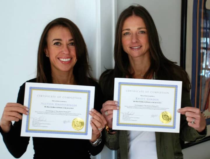 Allyson Greifenberger (left) and Kristy Gordon (right) with their certifications.
