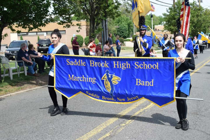 The Saddle Brook High School Marching Band lead the Memorial Day Parade. 