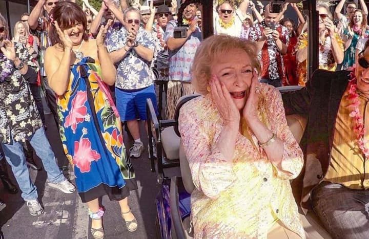 Adoring fans applaud Betty White in a recent photo.