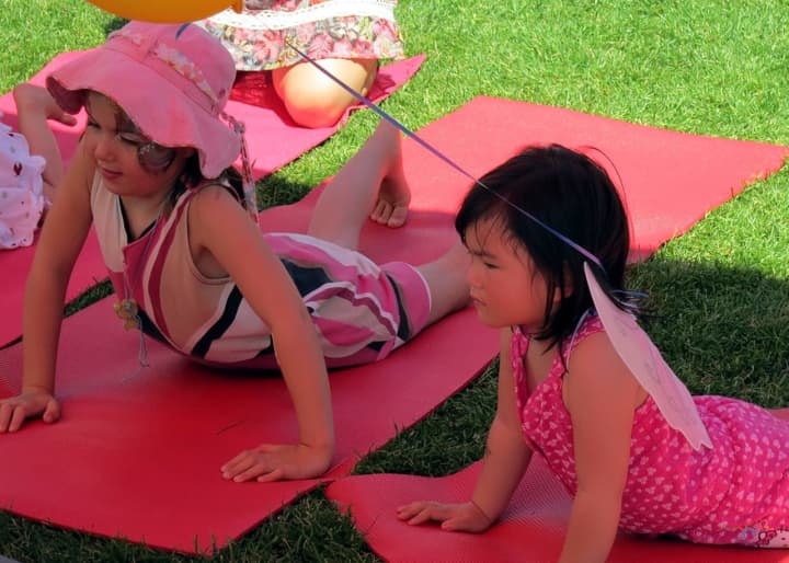 Youngsters like these can ward off kindergarten jitters with family yoga night at Westport Library.