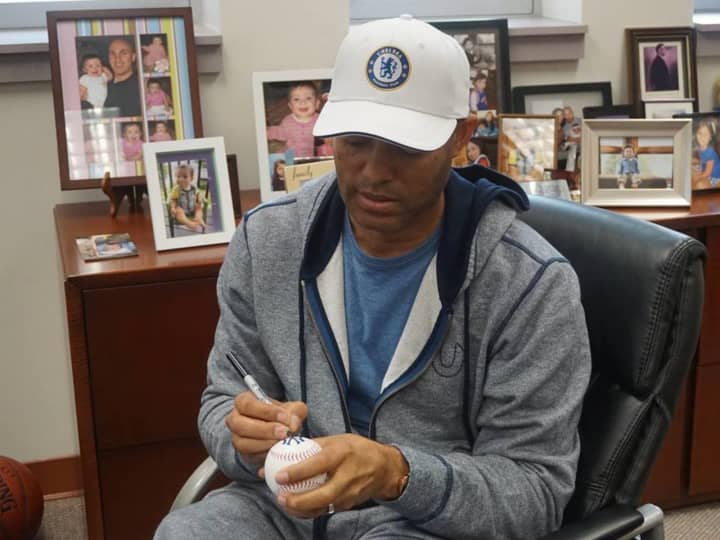 Mariano Rivera signing baseballs for New Rochelle elementary school students.