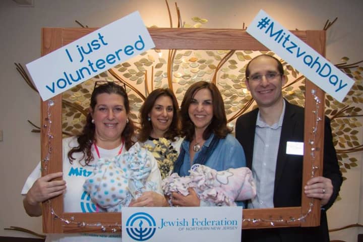 Rabbi Noah Fabricant, far right, and members of Temple Beth Or unite for Mitzvah Day.