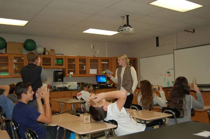 Byram Hills High School teacher Julie Wilson takes students on a virtual field trip using cardboard viewers and phones that allow panoramic views.